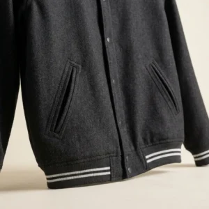 Varsity jacket with angled welt pockets